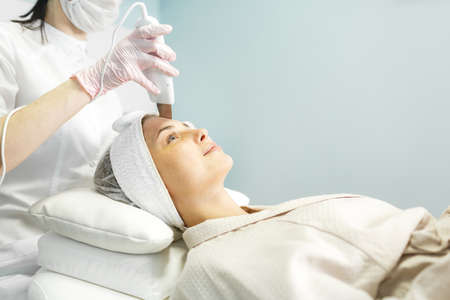 Young and beautiful girl in the clinic of natural beautyの写真素材