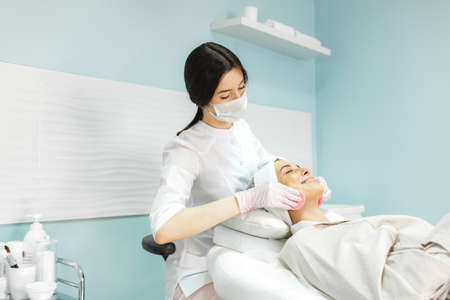 Young and beautiful girl in the clinic of natural beauty