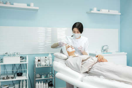 Young and beautiful girl in the clinic of natural beautyの写真素材