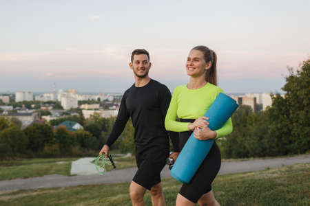 Young pare is engaged in outdoor sports