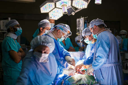 Surgeons in the operating room with a patient
