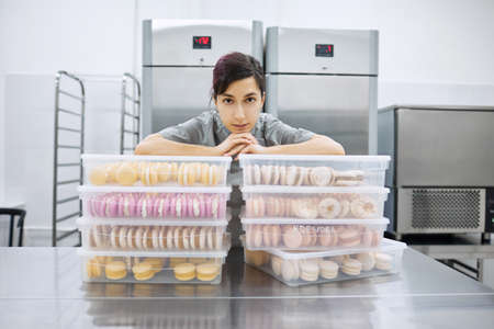 Portrait of a beautiful pastry chef girlの写真素材