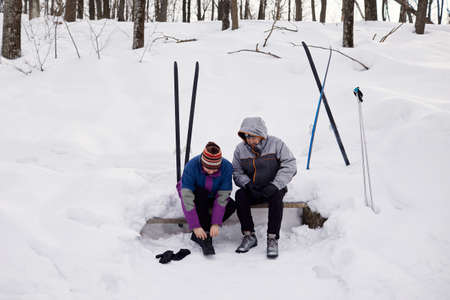 An active elderly couple is engaged in skiingの写真素材