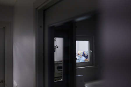 Surgeons performing eye surgery in the operating room