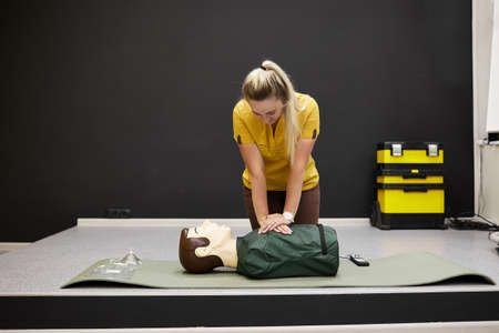 The doctor demonstrates first aid skills. Heart massageの写真素材