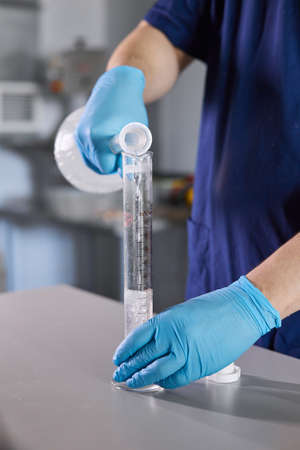 Scientists work in the laboratory. A researcher conducts laboratory research