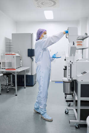 A laboratory worker prepares equipment for the study