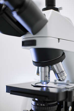 Close-up of a microscope in the laboratory. View through a magnifying glass