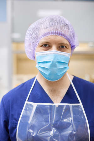 Portrait of a scientist in a protective mask. Close-up