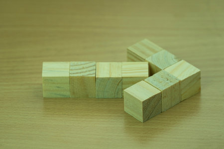 Wooden block stacking as step stair on wood background, business growth concept idea.の写真素材