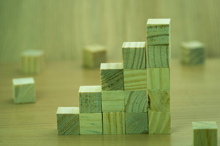 Wooden block stacking as step stair for business growth success concept.の写真素材