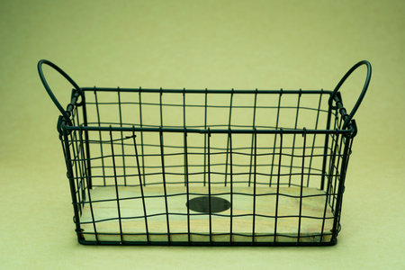 Empty shopping basket on green background. Selective focus. Shallow depth of field. Toned.の写真素材