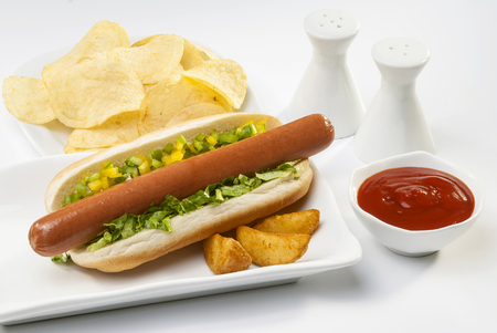 Chicken Jumbo Hotdog sandwich with fries & Ketchup on white plateの写真素材