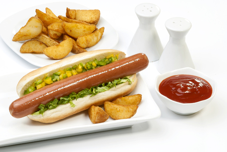 Chicken Jumbo Hotdog sandwich with fries & Ketchup on white plateの写真素材