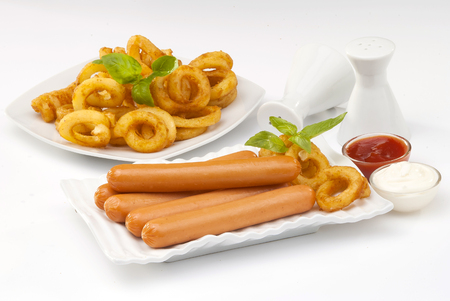 Chicken franks with potato swirls basil and ketchup with mayonnaiseの写真素材