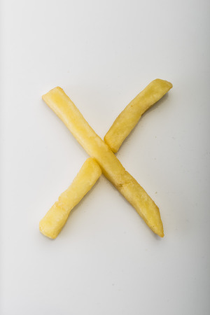Alphabet X formed by french friesの写真素材