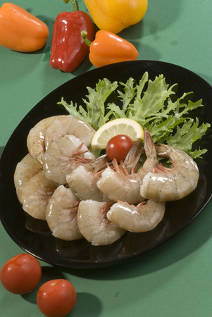 Raw prawns arranged on a plateの写真素材