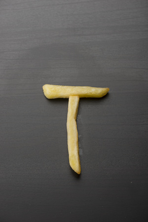 Alphabet T formed by french friesの写真素材