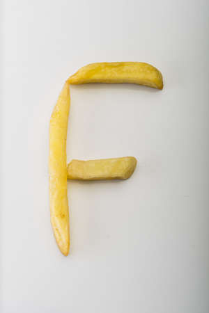 Alphabet F formed by french friesの写真素材