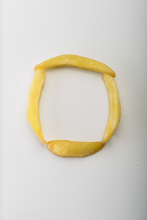 Alphabet O formed by french friesの写真素材