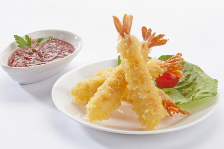 Tempura Jumbo Shrimps with salad and salsa dip on white plate and white backgroundの写真素材