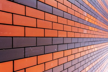 Brick wall and falling snow. Strips of brickの写真素材