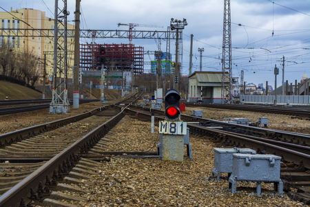 Railway traffic light. Railway station. Rails and sleepersの写真素材
