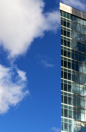 The edge of the building. Skyscraper on blue sky backgroundの写真素材