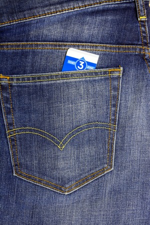 In a pocket dark blue jeans inserted bus ticketの写真素材