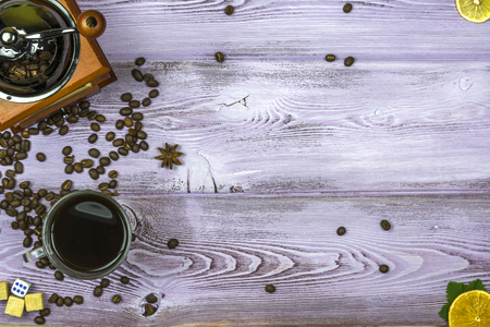 coffee grinder with coffee beans, sugar pieces, lemon and orange slices, coffee Cup.の写真素材