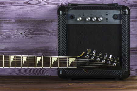 Guitar power amplifier on the table and electric guitarの写真素材