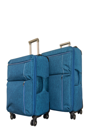 Two turquoise travel suitcases on white background. Isolate. Voyage with big suitcaseの写真素材