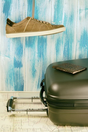 Travel bag. Fees in trip, shoes, passport and map. Summer voyageの写真素材