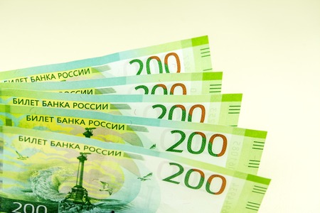 Russian money. Banknotes of 200 rubles on a light background.