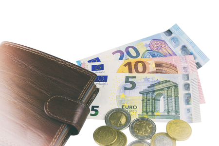 Isolated on white. EU cash. Banknotes of 5, 10, 20 euros. Some coins Man's brown walletの写真素材