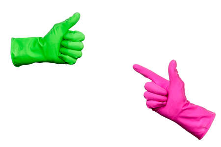 Isolated on a white background. Two hands with rubber gloves. Hand in pink glove and hand in green glove.の写真素材