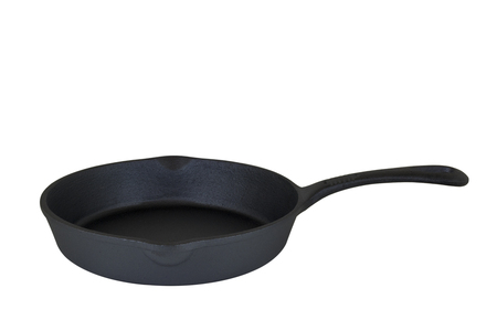 Small black cast iron frying pan on white background isolatedの写真素材