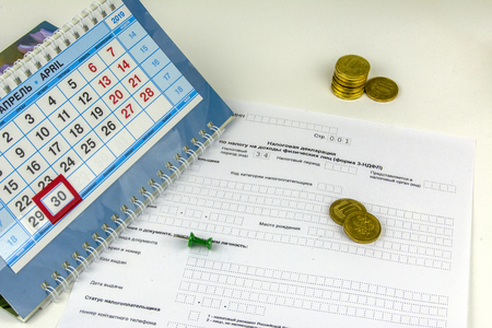 Russia. Form of Annual Declaration for payment of personal income tax. Desktop calendar with the last date of payment of personal income taxの写真素材