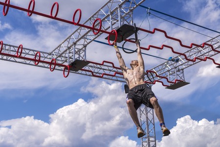 Moscow, Russia, 02 June 2019. Athlete passes the baton. Overcoming obstacles on his handsのeditorial素材