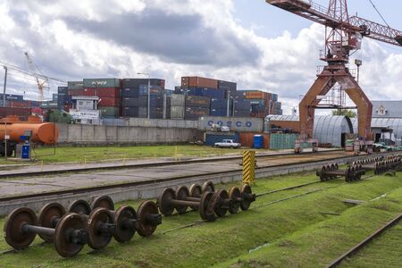 Moscow, Russia. 19 July 2019. Cargo terminal. Warehouse with metal containers. Cargo crane on rails.