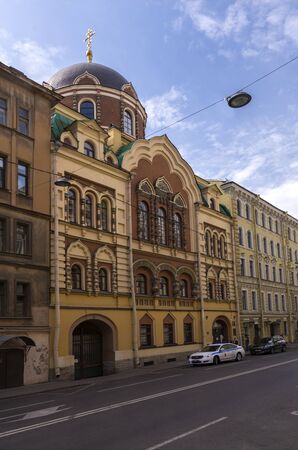 St. Petersburg, Russia. 7 Aug 2019. The Church is located between the houses in the Old street of the city.のeditorial素材