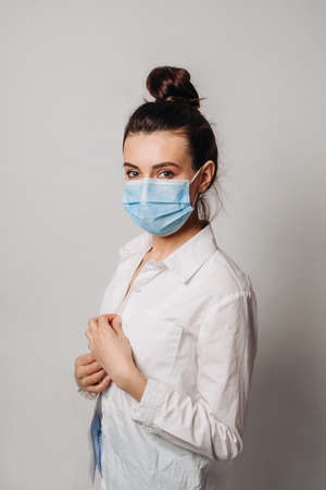 Portrait young asian woman wearing hygienic mask to prevent infection isolated on white background.の写真素材