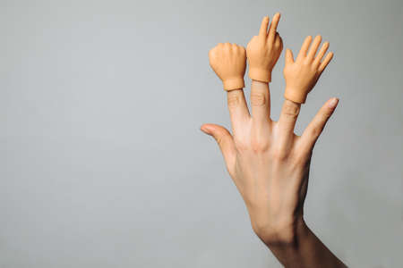 Gesturing hands on a white background. Rubber finger tips