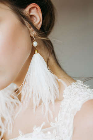 Bride wears earrings closeup style, elegant, dress, elegance, beautiful, accessoriesの写真素材