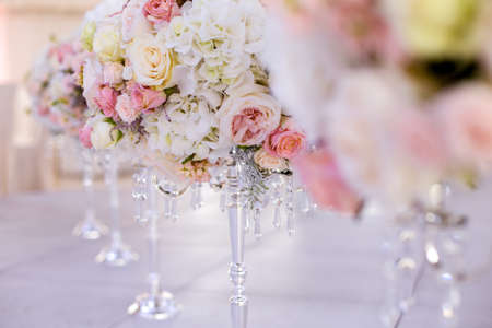 wedding spherical compositions . pink and cream roses, white hydrangeas on a crystal stand.perspective, wedding decor.の写真素材