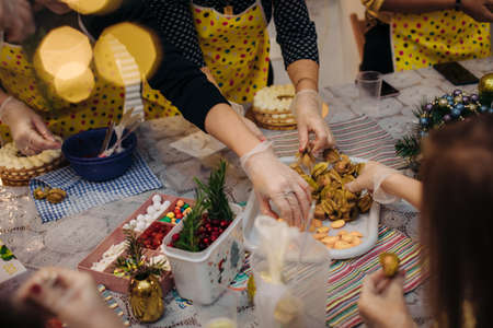 Christmas edible decorations ,for cake decoration. Hands of the pastry chef .Christmas holiday atmosphere.の写真素材