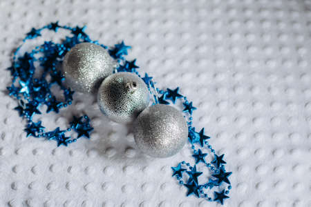 several Christmas balloons and a garland on a white background with a space for text. Christmas and New year conceptの写真素材