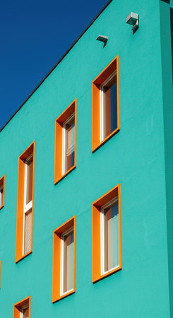 Modern apartment buildings on a sunny day with a blue sky. Facade of a modern apartment buildingの素材