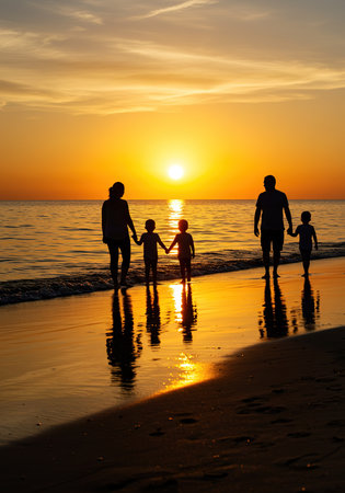 Silhouette of happy family on the beach at beautiful sunset.の素材