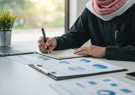 businessman hand working with finances about cost and calculator in office.の素材